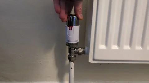 Turning up the heating Stock Footage 319897587