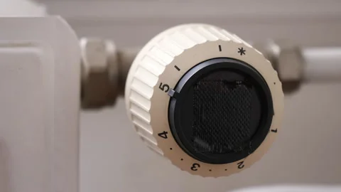Turning off heating inside a home. Close up turning knob. Stock Footage 220844220