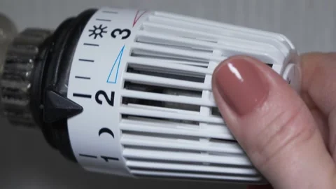 Turning on heating with regulator Stock Footage 146313123