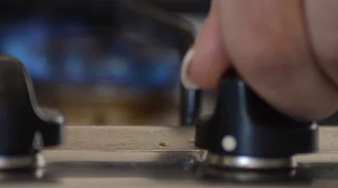 Turning a Hob Flame Down to Low Stock Footage 59345738