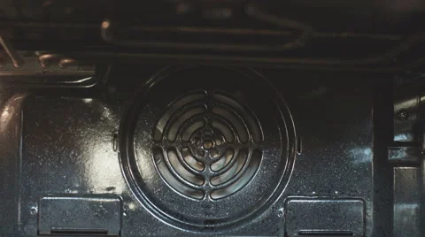 Turning on a kitchen oven Stock Footage 62366396