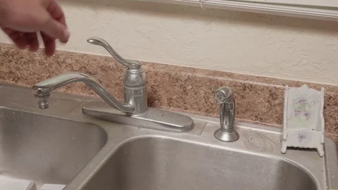 Turning on Kitchen Sink Side Sprayer Stock Footage 80015326