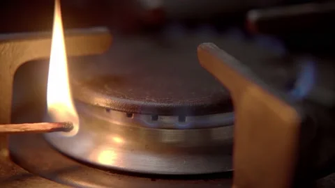Turning on kitchen stove flame with Match, Close up Footage of Fire Stock Footage 166086335