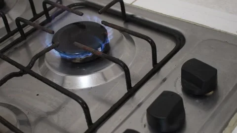 Turning On Kitchen Stove, Hand Igniting Gas Burner, Cooking Stove Being Lit Stock Footage 315193957