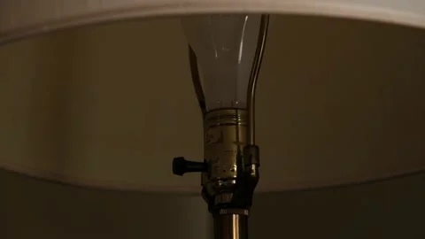 Turning off a Lamp 4K Stock Footage 150836908