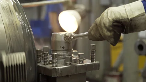 Turning lathe in action. Facing operation of metal blank on turning machine with Stock Footage 130704788