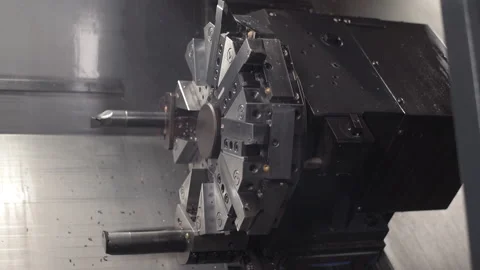 Turning lathe in action. Facing operation of metal blank on turning machine with Stock Footage 154387468