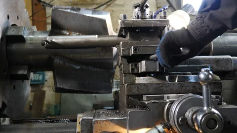 Turning lathe in action. Old turning lathe machine in turning workshop produce a Stock Footage 130624609