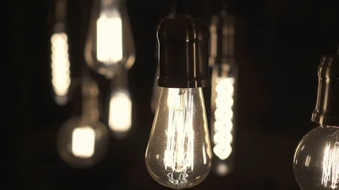 Turning light ON and OFF. Decorative antique Edison style light bulbs. Stock Footage 129135988
