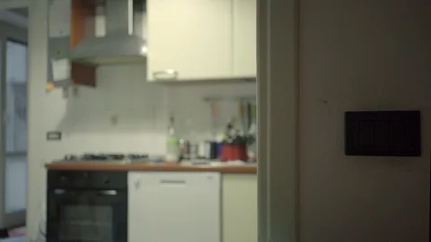 Turning the light off in a kitchen Stock Footage 99298072