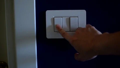 Turning on light switch Stock Footage 76928641