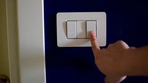 Turning on light switch Stock Footage 76928650