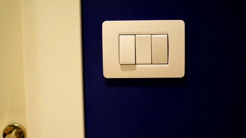 Turning on light switch Stock Footage 76928666