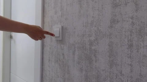 Turning a Light Switch On  – Hand Interaction in a Home Corridor Video stock 274897540