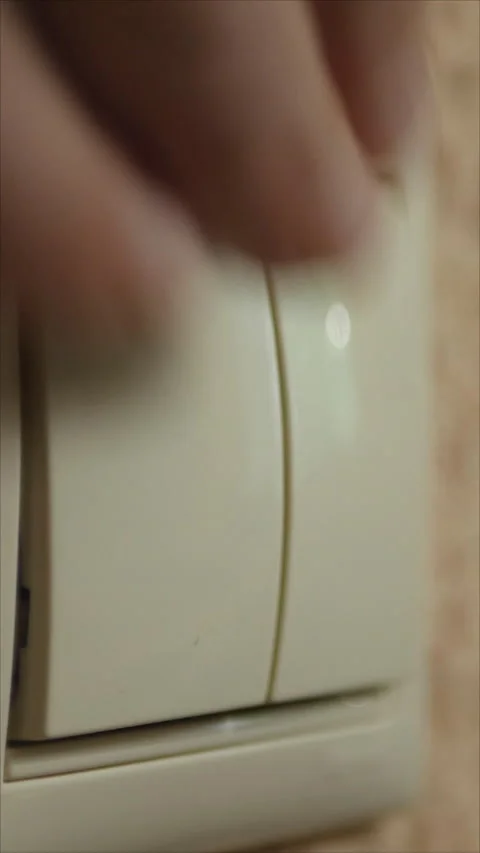 Turning A Light Switch On In The Room. Vertical.   Stock Footage 284171741