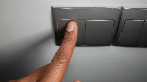 Turning on the lights with a simple switch press Stock Footage 311794379