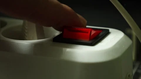 Turning on the machine with a push button at a workshop, showcasing the gear in Stock Footage 321664503