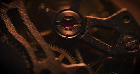 Turning metal gears and cogs inside a clock Stock Footage 337170357
