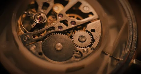 Turning metal gears and cogs inside a clock Stock Footage 337170468