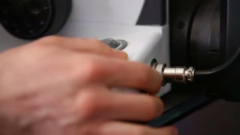 Turning microscope on Stock Footage 69166506
