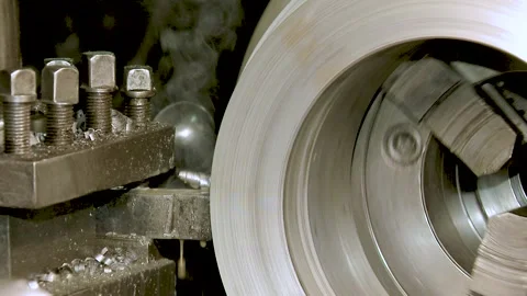 Turning Milling Combine Machine Cutting Metal Workpiece with Shavings at Factory Stock Footage 201109191