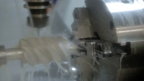 Turning milling machine with cooling system cutting metal workpiece at factory Stock Footage 144475319