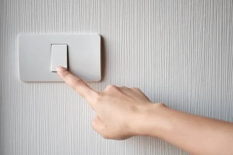 Turning on or off on light switch Stock Photos