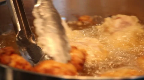 Turning Over Fried Chicken Stock Footage 61544841