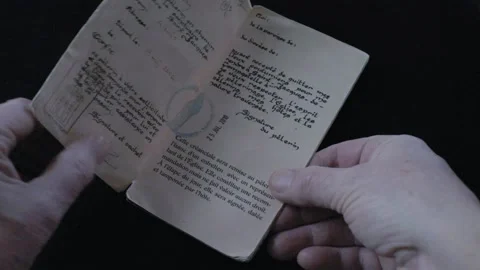 Turning over the leaves of a credential of the way to Santiago de Compostela Video stock 169314469
