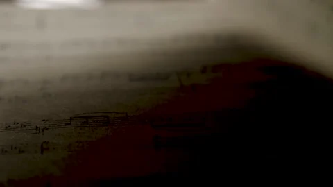 Turning over musical notes close up in daylight Stock Footage 150564156