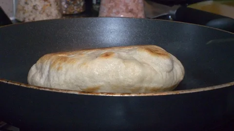 Turning Over a Pita Bread Stock Footage 89001358