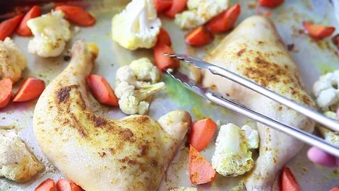 Turning over roasted vegetables Stock Footage 76746989