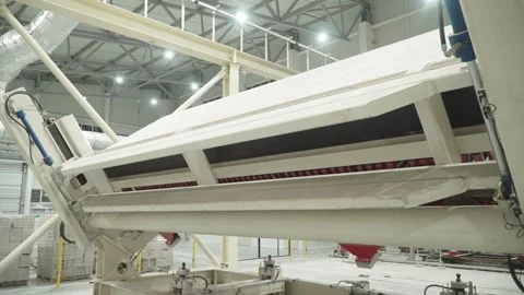 Turning over a stack of cut aerated concrete blocks Stock Footage 281010362