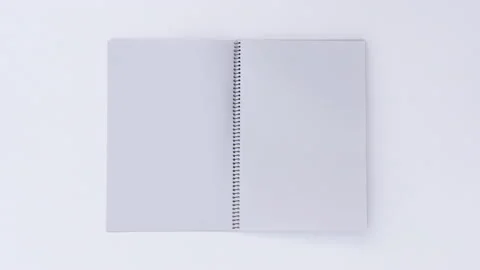 Turning page binder book by wind on a white background Stock Footage 162641570