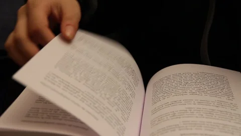 Turning a page in a book Stock Footage 79048311