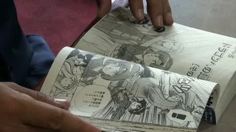 Turning the page of a classic comic book (manga) in Japan Stockbeeldmateriaal 12718937