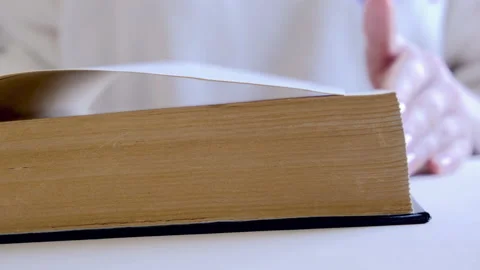 Turning pages of an old book. 4K footage Stock Footage