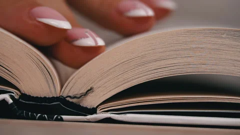 Turning Pages in a White Book Close Up Slow Mo Stock Footage 212232811