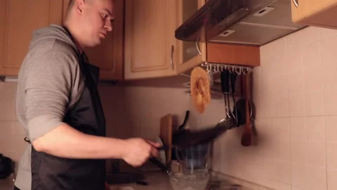 Turning a pancake in a pan Stock Footage 152482854