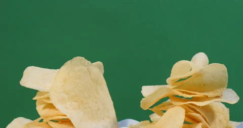 Turning a pile of potato chips Stock Footage 162623233