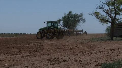 Turning plows at end of the row and plowing in lots of dust, 4K. Stock Footage 100043720