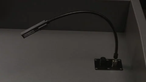 Turning on a podium lamp Stock Footage 131628565