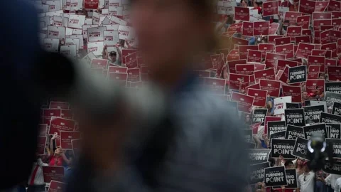 Turning Point signs fill the crowd at the Charlie Kirk memorial service Stock Footage 345298064