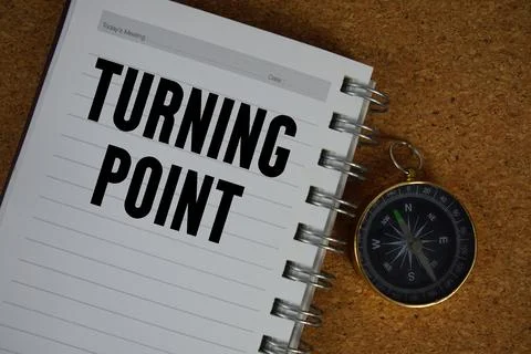 Turning Point text written on notebook paper with compass 库存照片