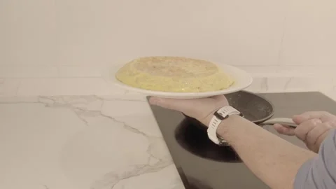 Turning the potato omelette upside down 스톡 동영상 241503267