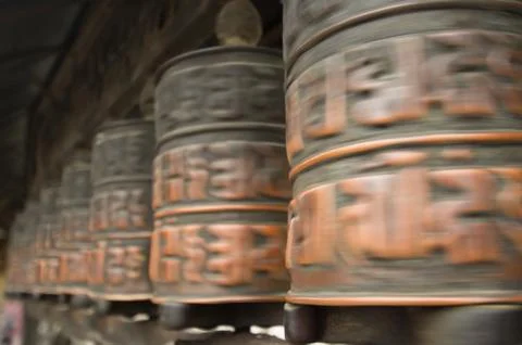 Turning prayer wheels Stock Photos