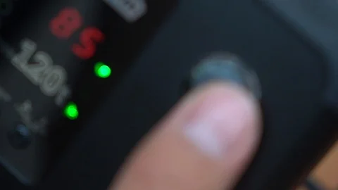 Turning on professional studio lights Stock Footage 107325664