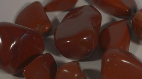 Turning red Jasper - half-precious stones Stock Footage 37936212