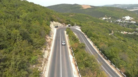 Turning road in the mountains 4K Stock Footage 207807292