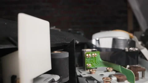 Turning roller and microchip against reading head in room Stock Footage 180966070